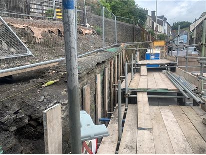 Works continue to repair the retaining wall at High Street in Llantrisant